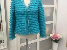 Chaqueta de volantes verde marina